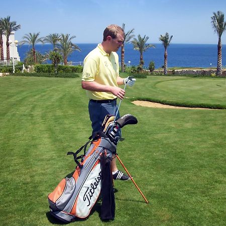 Stella Di Mare Beach Hotel & Spa Шарм ел-Шейх Екстериор снимка Golf player with a golf bag